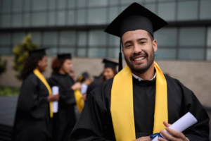 Latinx male in graduation cap and gown.