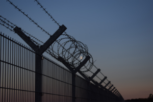 This is a stock image of a wired fence at a border.