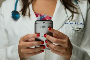 Image of healthcare professional holding mobile phone