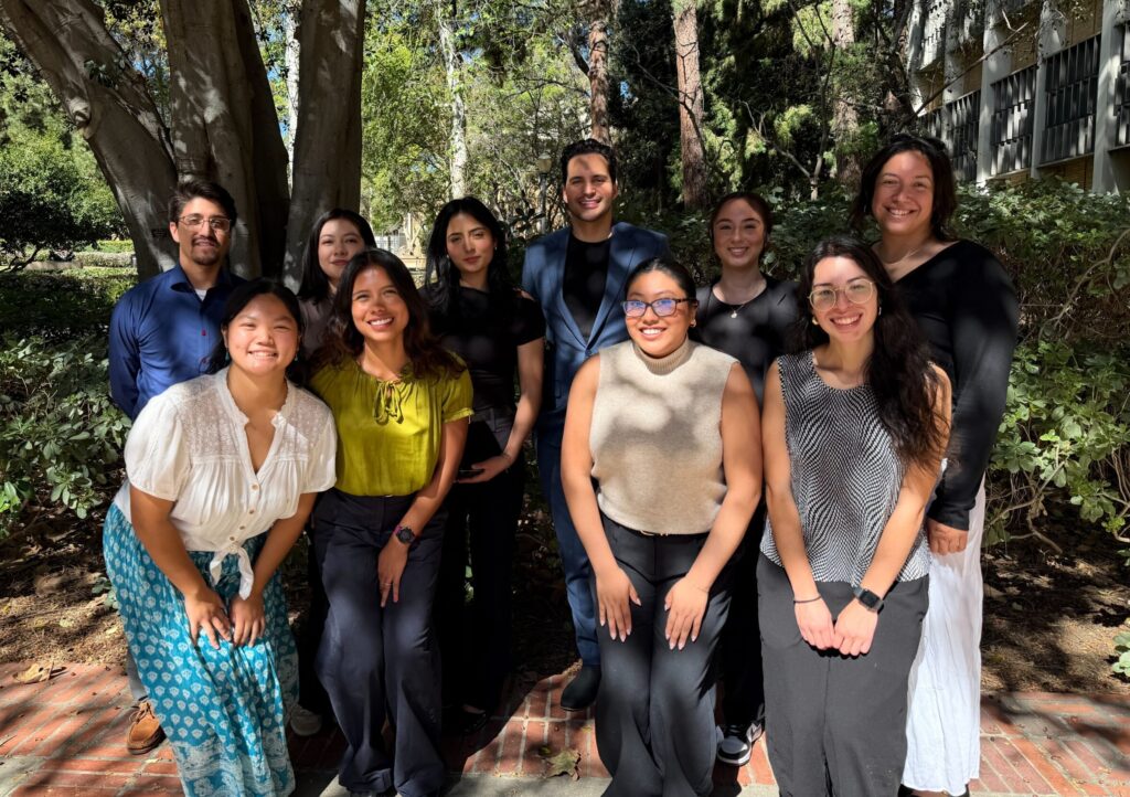 LPPI policy fellows pose and smile alongside Telemundo broadcaster Enrique Chiabra.